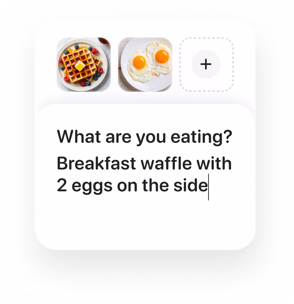A breakfast waffle topped with berries displayed alongside two fried eggs on a white plate. The text prompts for a food description.